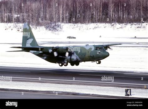 Kulis Air National Guard C 130 Takes Off From The Snow Cleared Runway